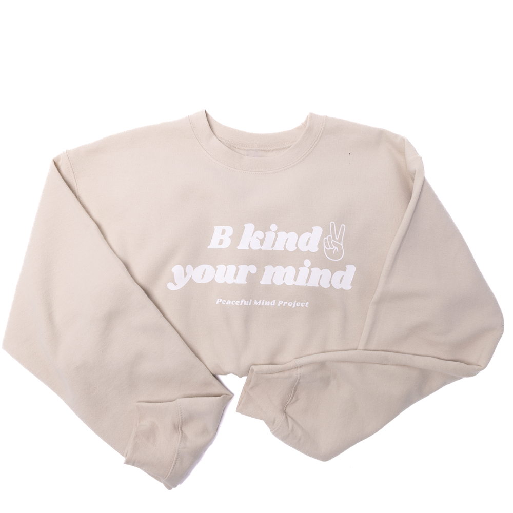 
                  
                    Closeup of Female weSand sweatshirt with B Kind 2 your Mind graphic.
                  
                